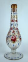 A clear glass and painted Turkish influence vase of slender baluster form, decorated with roses