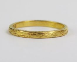 A 22ct Gold Wedding Band with chased scrolling decoration, 2mm wide, Birmingham 1933, SH,size N,