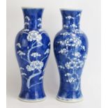 A Chinese blue and white vase of ovoid from with prunus decoration, 31cm high together with a near