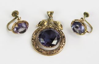 An Oriental 14K Gold and Amethyst Pendant (33.5mm drop) and pair of matching screw back earrings,