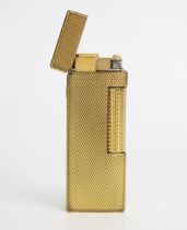 A gold plated Dunhill 70 lighter, with engine turned decoration.