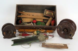 A late 19th century 3 1/2ins mahogany and brass half-starback fishing reel, a 2 1/2ins mahogany