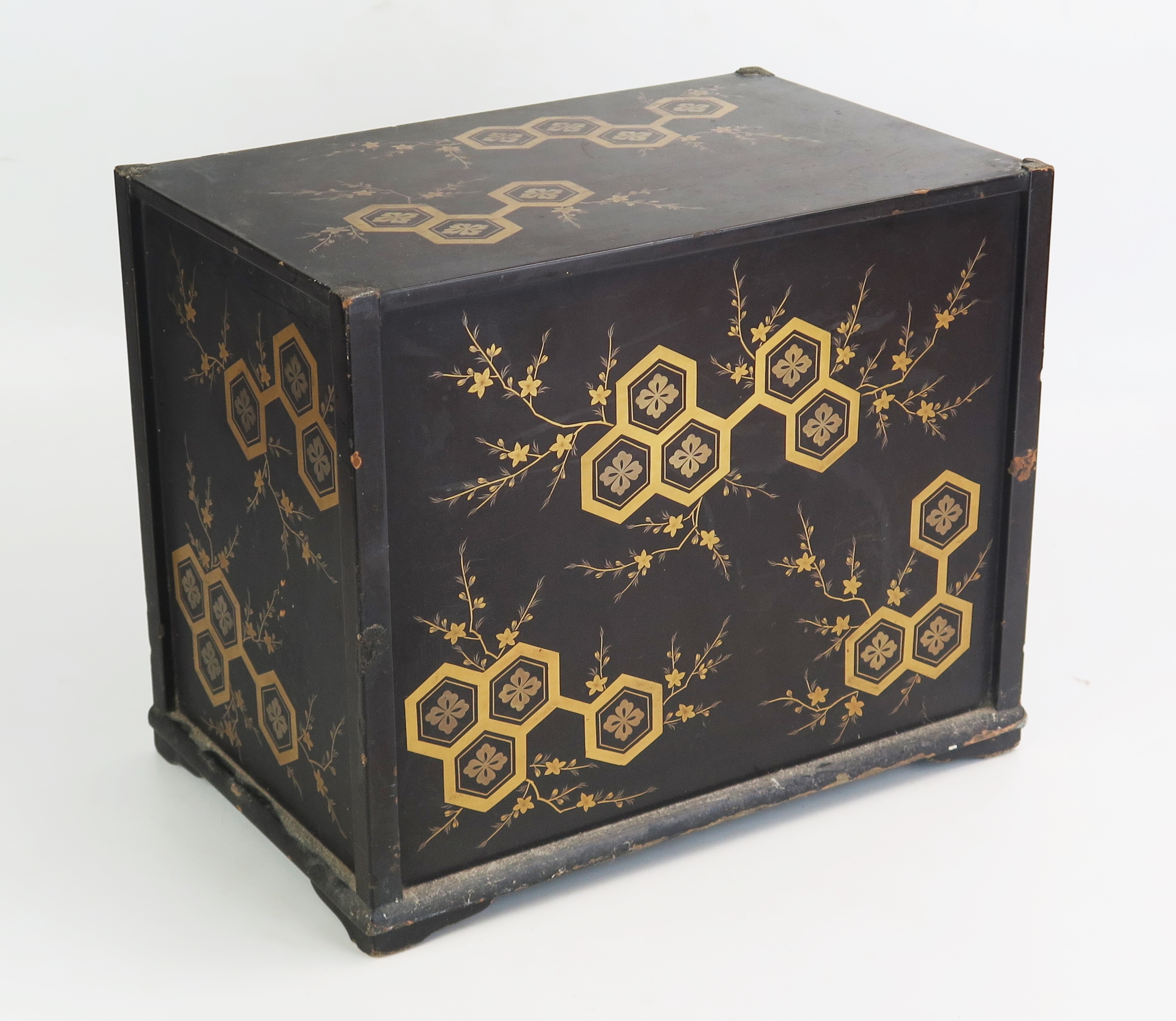 A Japanese lacquered Tansu, decorated all over with flowerheads and foliage, containing three long - Image 2 of 2