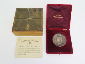 A Queen Victoria 1887 Silver Jubilee Silver Medallion by M. Rhodes &Sons in original red plush