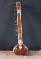 An Indian Sitar beautifully decorated with bone inlay and carvings - missing two tuning pegs