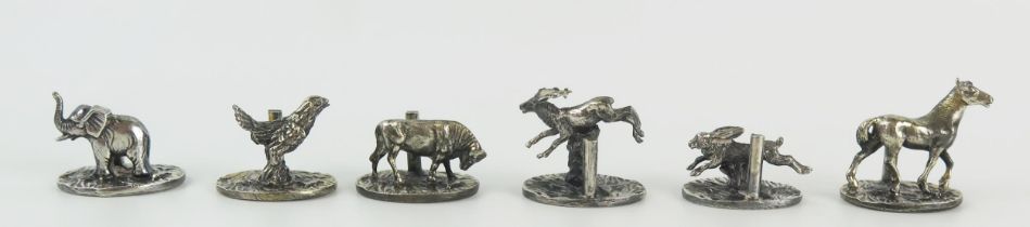 Six white metal novelty name place holders on oval bases, includes horse, elephant, hare, stag and