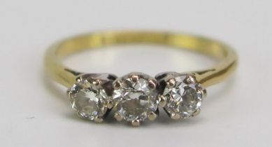 An 18ct Gold and Diamond Three Stone Ring, c. 3.8mm stone, stamped marks, size I.75, 2.16ct