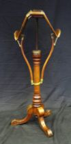 A Victorian mahogany and brass metamorphic music duet stand/table by Swann & Millican, with double