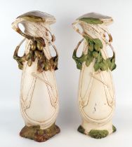 A pair of Royal Dux porcelain vases of art Nouveau influence, with trailing fruit decoration, both