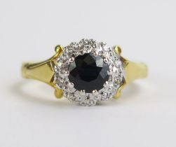 An 18ct Gold, Sapphire and Diamond Cluster Ring, 9mm head, stamped 18CT, size L, 4g