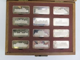 A set of twelve Elizabeth II silver limited edition ingots, 'Royal Palaces', contained in a wood