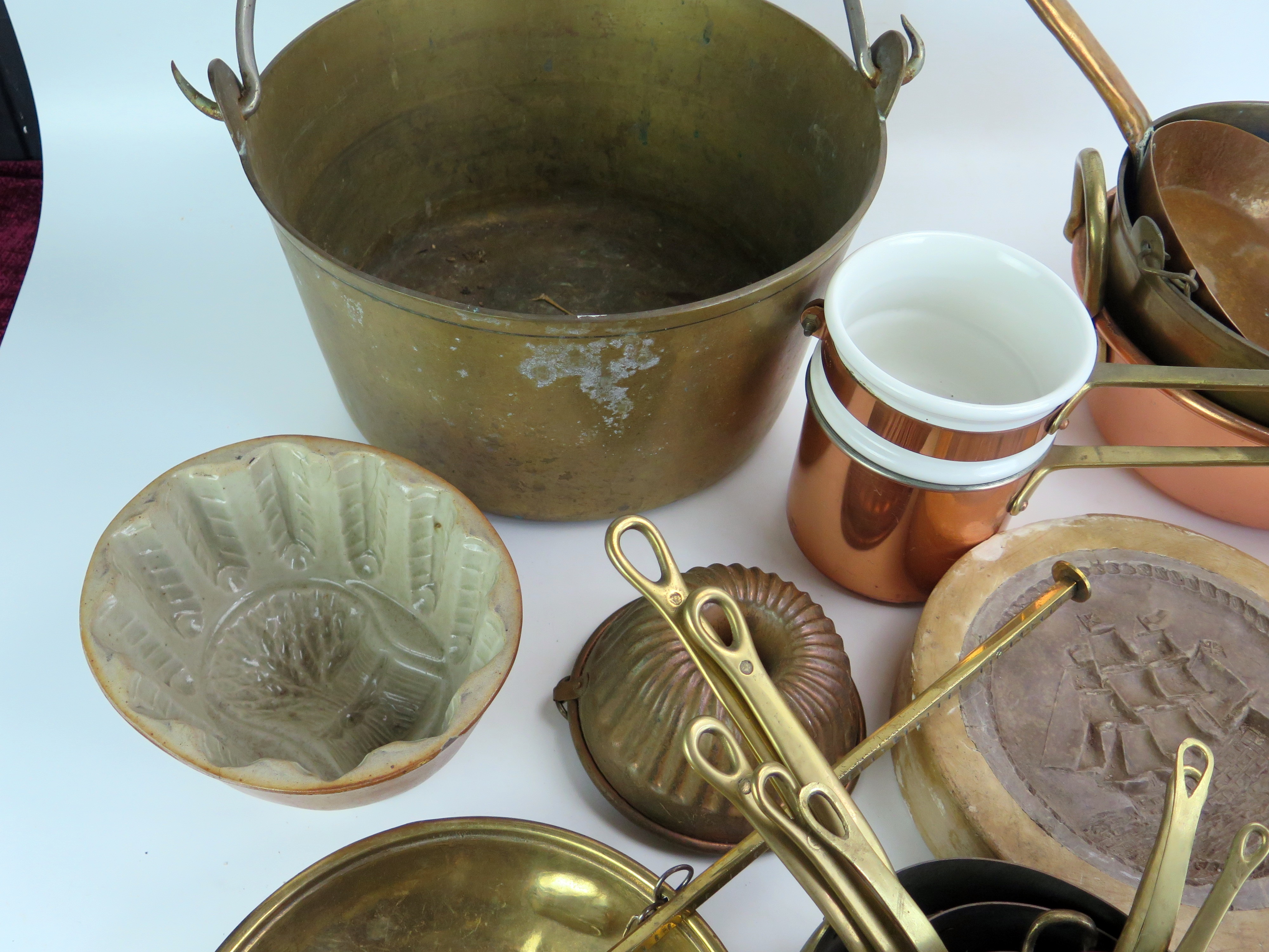 A collection of assorted kitchenalia, includes graduated saucepans, preserve pans, moulds, brass - Image 3 of 5