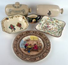 Two Doulton stoneware foot warmers, Doulton series ware plates, serving dish and cream jug.