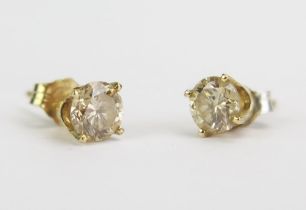 A Pair of American Diamond Stud Earrings in unmarked precious yellow metal settings, 5.1mm stones,