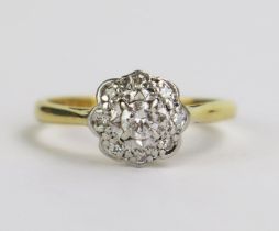 An 18ct Gold and Diamond Cluster Ring, 8.5mm platinum head, hallmarked, size K.5, 2.83g