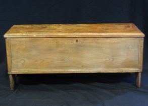 An antique elm and oak coffer of rectangular form, the hinged top with a moulded edge enclosing a