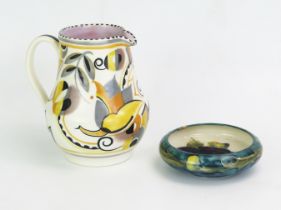 A Poole Pottery Ye pattern cream jug, by Truda Carter, 14,5cm high, together with a Moorcroft