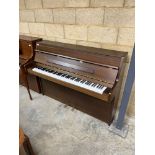 Kemble (c2002) A Windsor model upright piano in a satin cherry case; together with a stool.