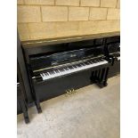 Essex (c2018) A Model 111 upright piano in a bright ebonised case.
