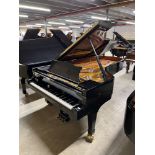 Steinway (c1994) A 9ft Model D grand piano in a bright ebonised case on square tapered legs.