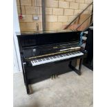 Essex (c2009) A Model 123 upright piano in a bright ebonised case.