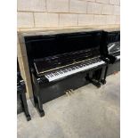 Boston (c2018) A Model 132 upright piano in a bright ebonised case.