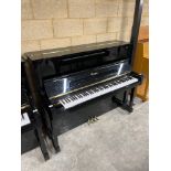 Essex (c2012) A Model 123 upright piano in a bright ebonised case.