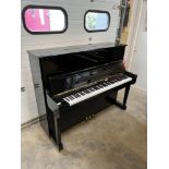 Essex (c2010) A Model 123 upright piano in a bright ebonised case.