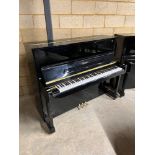 Essex (c2012) A Model 123 upright piano in a bright ebonised case.