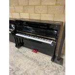 Essex (c2019) A Model 116 upright piano in a bright ebonised case.