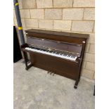 Kemble (c1999) A Model Oxford upright piano in a satin mahogany case.