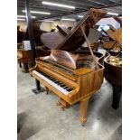 Steinway (c1981) A 5ft 10in Model O grand piano in a rosewood case on square tapered legs;