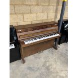 Welmar (c1987) A Regency Model upright piano in a traditional mahogany case.