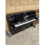Yamaha (c1998) A Model C110A upright piano in a bright ebonised case; together with an adjustable