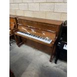 Yamaha (c1987) A Model P116NT upright piano in a bright walnut case; together with an adjustable