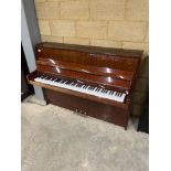Petrof (c2001) An upright piano in a modern style bright mahogany case; together with a stool.