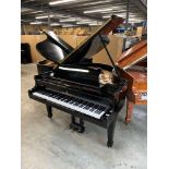 Steinway (c1958) A 5ft 7in Model M grand piano in a bright ebonised case on square tapered legs.