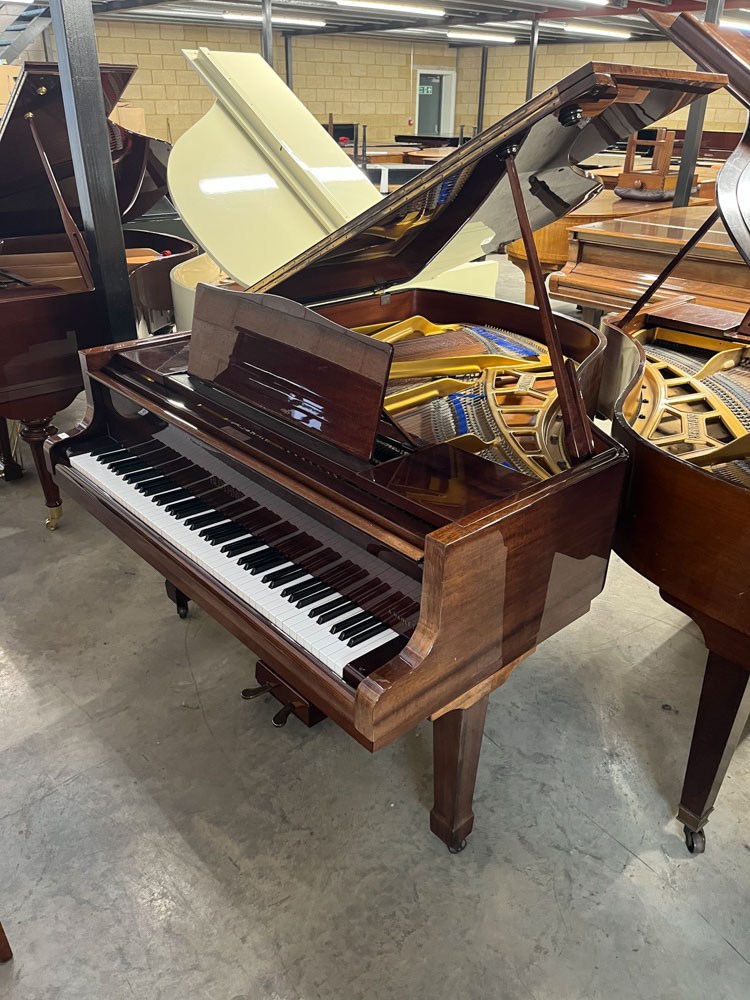 Blüthner (c1982) A 5ft 10in Style 10 grand piano in a bright mahogany case on square tapered legs;