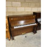 Samick (c1991) A Model SU118C upright piano in satin walnut case.