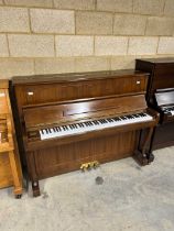 Samick (c1991) A Model SU118C upright piano in satin walnut case.