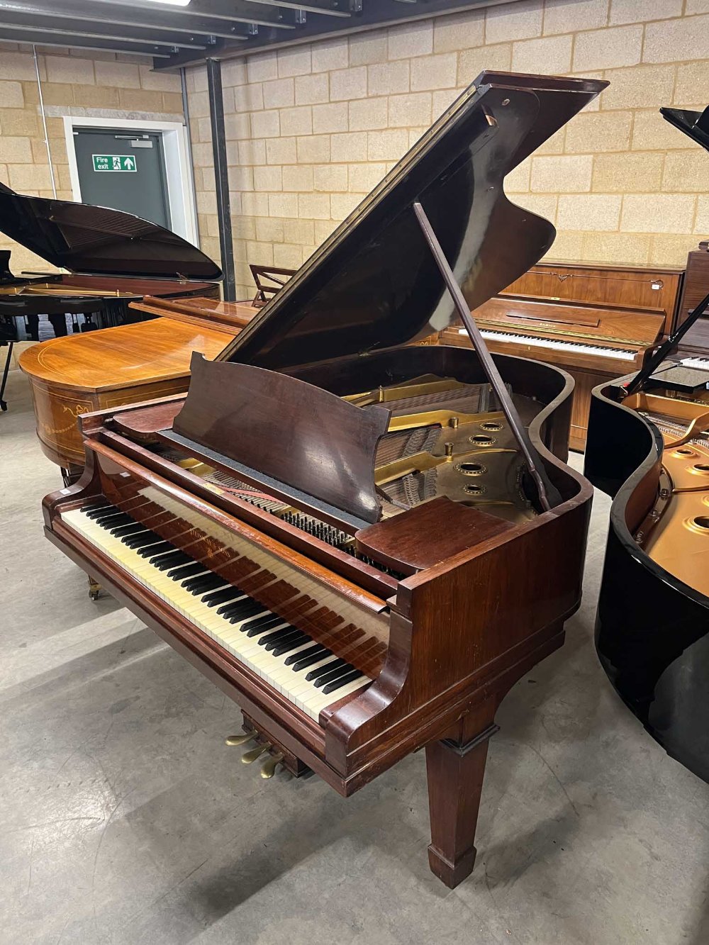 Steinway (c1923) A 6ft 2in Model A grand piano in a rosewood case on square tapered legs; together