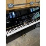 Kemble (c2013) A modern upright piano in a bright ebonised case, fitted with a silent system;