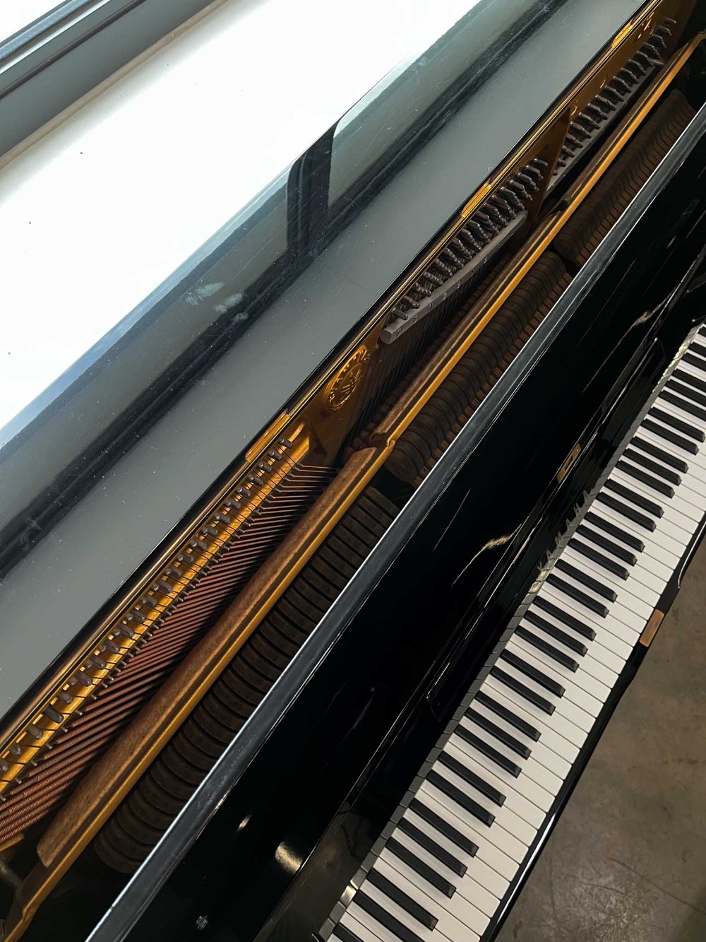 Yamaha (c1974) A Model U2 upright piano in a bright ebonised case; together with a matching stool. - Image 4 of 5