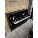 Kawai (c2022) A Model K-15 upright piano in a bright ebonised case; together with a stool.