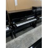 Yamaha No 2233573 (c1976) A 121cm Model U1G upright piano in a traditional bright ebonised case.