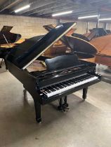 Yamaha (c1980) A 6ft 7in Model G5 grand piano in a bright ebonised case on square tapered legs.