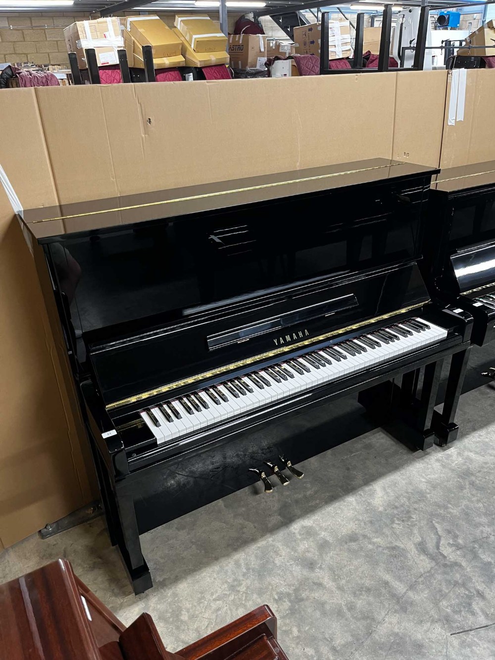 Yamaha (c1987) A 131cm Model U30BL upright piano in a traditional bright ebonised