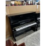 Yamaha (c1987) A 131cm Model U30BL upright piano in a traditional bright ebonised