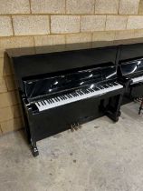 Knight (c1996) A Model 120 upright piano in a bright ebonised case; together with a matching stool.