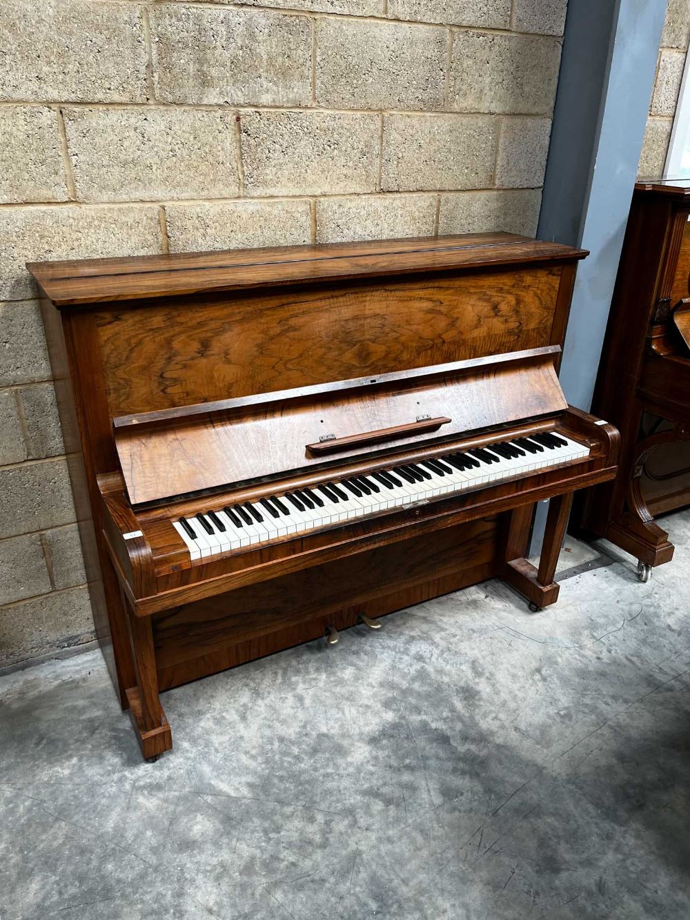 Steinway (c1936) A Model V upright piano is a figured walnut case. IRN: EECK883Z